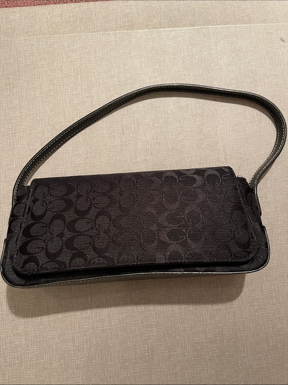 Small black fabric and faux leather purse with 6” drop strap & magnetic closure